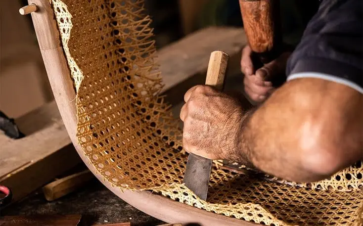 Merging function with tradition – every curve of the chair is enhanced with handwoven rattan detailing.